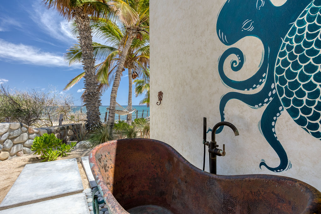 Outdoor copper wellness tub nestled in the garden